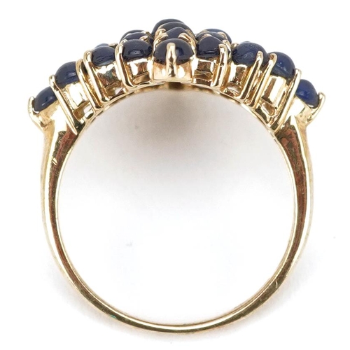 2066 - A 9ct gold cabochon sapphire cluster ring, size N, 3.9g.