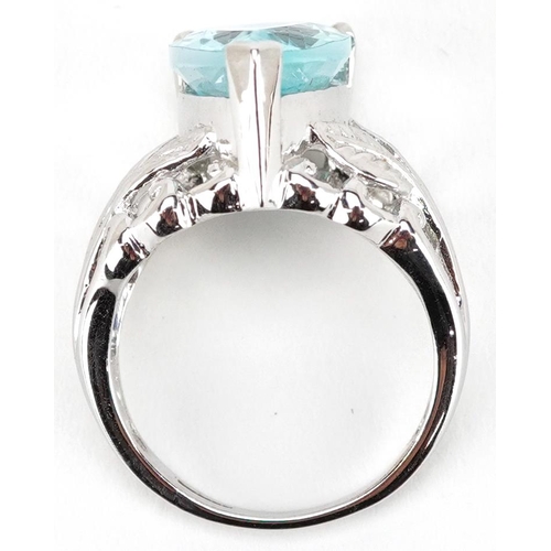 2324 - A 9ct white gold blue topaz teardrop ring with naturalistic setting, the topaz approximately 15.95mm... 