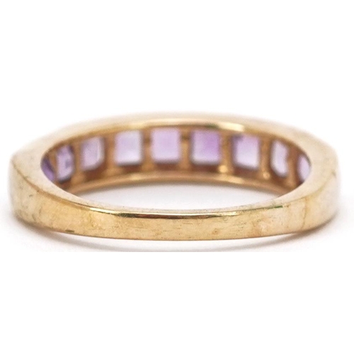 2355 - A 9ct gold amethyst half eternity ring, size N, 2.6g.