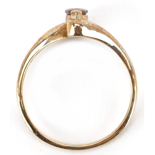 2359 - A 9ct gold yellow stone crossover ring, size N/O, 2.0g.