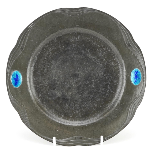 117 - An early 20th century circular pewter dish with enamelled decoration, possibly retailed by Liberty, ... 