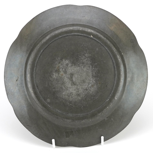 117 - An early 20th century circular pewter dish with enamelled decoration, possibly retailed by Liberty, ... 