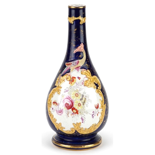 73 - An early Victorian hand painted pearlware bottle vase, 30cm high.