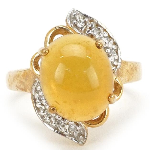 2362 - A 9ct gold cabochon orange stone and diamond dress ring, size N, 4.5g.