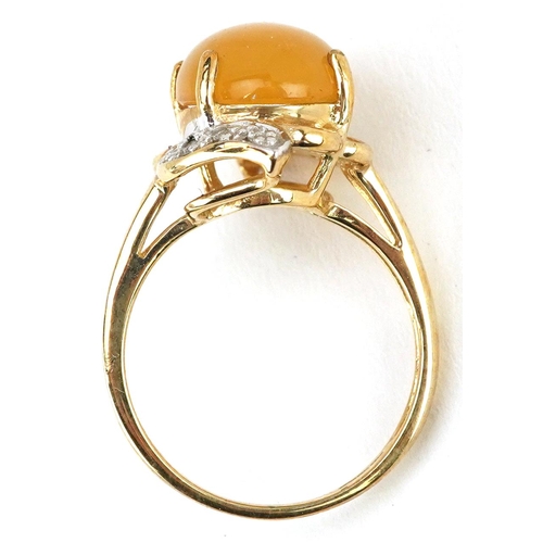 2362 - A 9ct gold cabochon orange stone and diamond dress ring, size N, 4.5g.