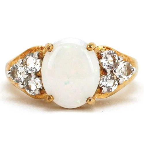 2366 - A 9ct gold cabochon opal and white topaz ring, size N, 4.0g.