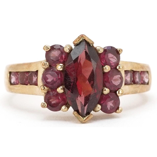 2283 - A 9ct gold garnet and pink tourmaline dress ring, size N, 3.3g.