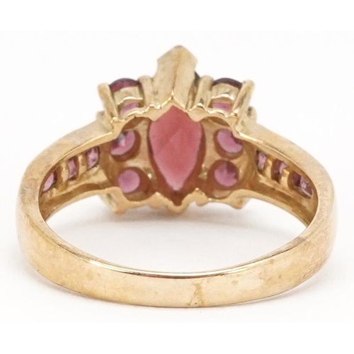 2283 - A 9ct gold garnet and pink tourmaline dress ring, size N, 3.3g.