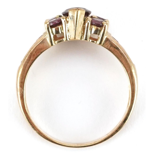 2283 - A 9ct gold garnet and pink tourmaline dress ring, size N, 3.3g.