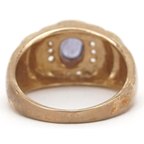 2070 - A Modernist 9ct gold cabochon purple stone and white spinel ring, size T, 8.2g.