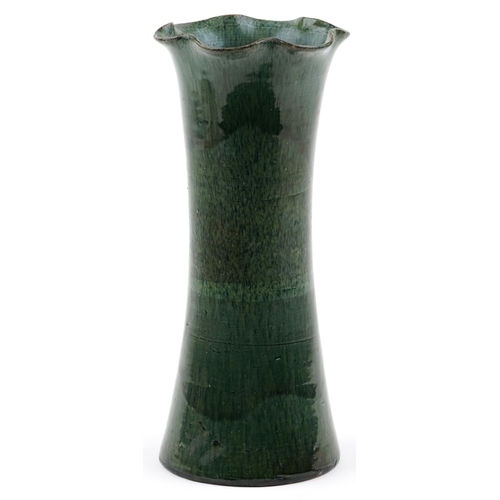 1255 - An early 20th century Ewenny green glazed pottery vase of flared form, 35cm high.