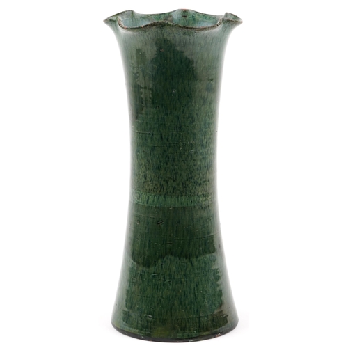 1255 - An early 20th century Ewenny green glazed pottery vase of flared form, 35cm high.