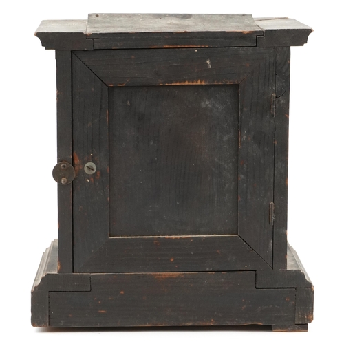 1252 - An early 20th century oak cased mantle clock, the silvered dial raised on a plinth base, with pendul... 