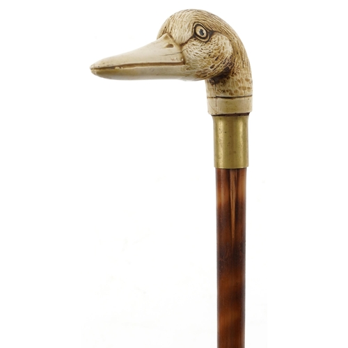 284 - An early 20th century bamboo swordstick with a resin handle in the form of a duck's head.