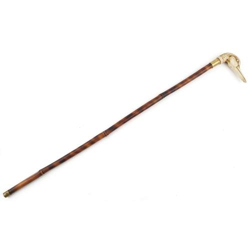 284 - An early 20th century bamboo swordstick with a resin handle in the form of a duck's head.