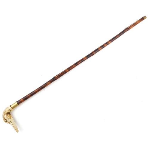 284 - An early 20th century bamboo swordstick with a resin handle in the form of a duck's head.