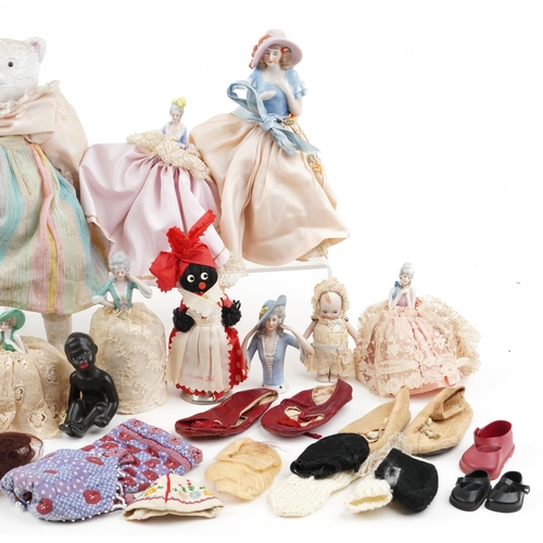 1287 - A small collection of early 20th century porcelain, bisque and plastic half dolls and full length do... 