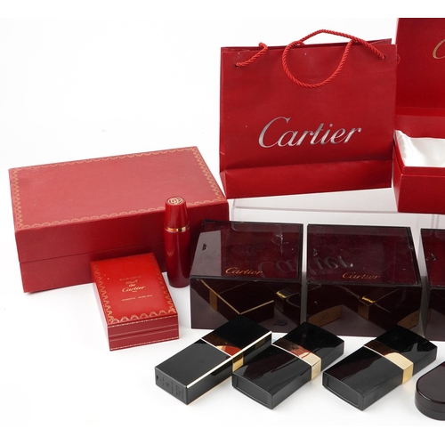 2581 - A small collection of jewellery and perfume boxes by Cartier and Harrods.