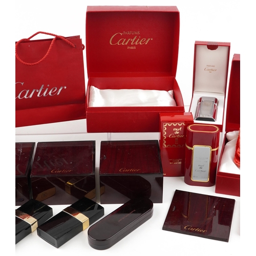 2581 - A small collection of jewellery and perfume boxes by Cartier and Harrods.