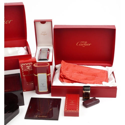 2581 - A small collection of jewellery and perfume boxes by Cartier and Harrods.