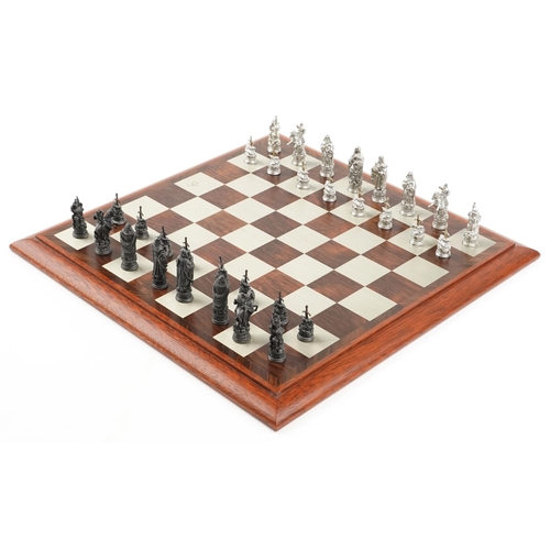 587 - A Camelot chess set by Selangor Pewter within a rosewood box, 39cm wide.