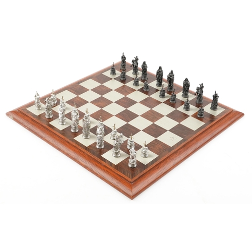 587 - A Camelot chess set by Selangor Pewter within a rosewood box, 39cm wide.