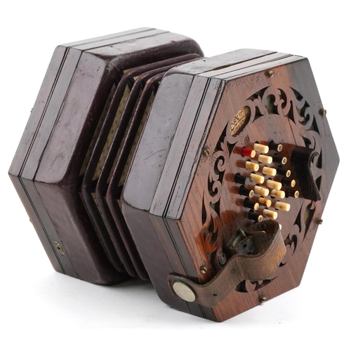 451 - A late Victorian rosewood forty eight button concertina manufactured by Burton, London, with it's or... 