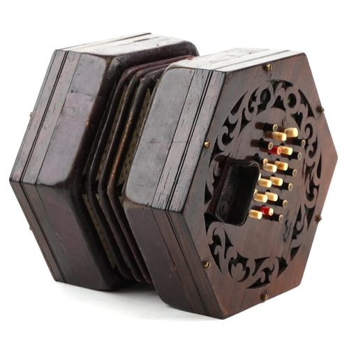 451 - A late Victorian rosewood forty eight button concertina manufactured by Burton, London, with it's or... 