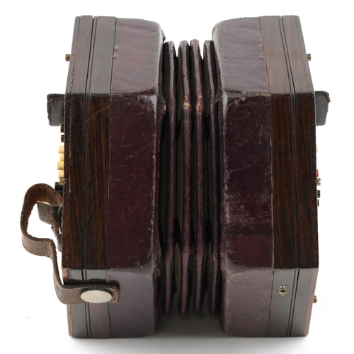 451 - A late Victorian rosewood forty eight button concertina manufactured by Burton, London, with it's or... 