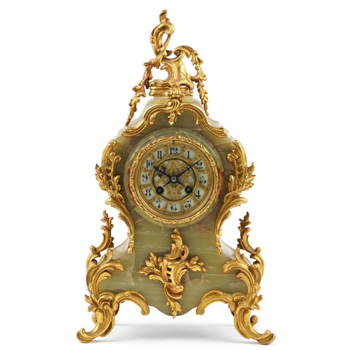 332 - An early 20th century French onyx and gilt metal mounted mantle clock, the white enamelled dial deta... 