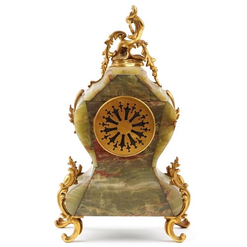 332 - An early 20th century French onyx and gilt metal mounted mantle clock, the white enamelled dial deta... 