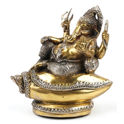 148 - An Indian gilt metal figure of Ganesha, 20th century, modelled seated upon shell, 15cm high.