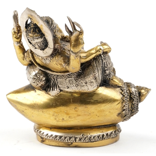 148 - An Indian gilt metal figure of Ganesha, 20th century, modelled seated upon shell, 15cm high.