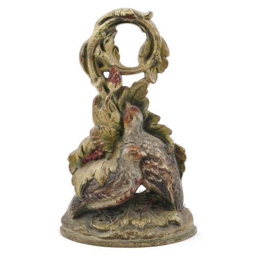 320 - An early 20th century cast iron and hand painted doorstop in the form of two birds amongst foliage, ... 