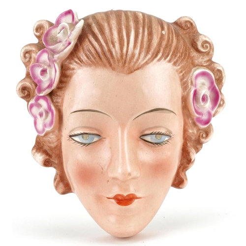 121 - An Art Deco Goebel hand painted porcelain wall mask, 18cm x 16cm.