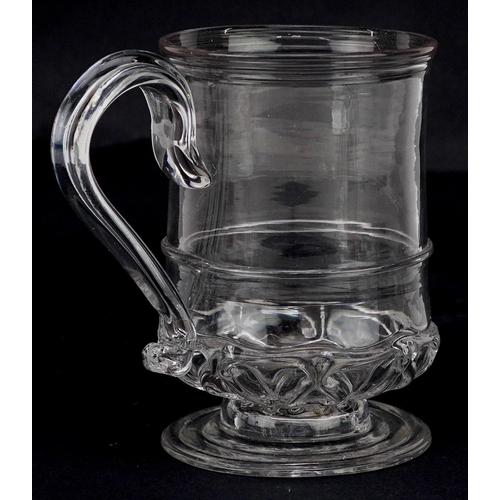 138 - A 19th century hand blown clear glass tankard, 10cm high.