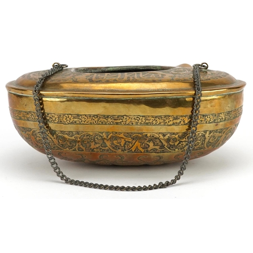 1170 - A 20th century eastern brass hanging incense burner decorated with figures and script, 18cm wide.