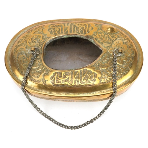 1170 - A 20th century eastern brass hanging incense burner decorated with figures and script, 18cm wide.