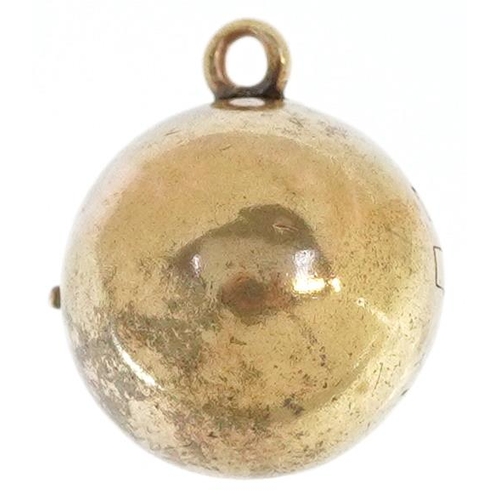 2523 - A yellow metal ball locket pendant, 1.4cm in diameter, 3.5g.