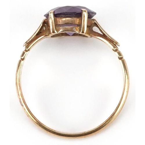 2211 - A 9ct gold blue/purple stone solitaire ring, possibly alexandrite, size N/O, 2.3g.