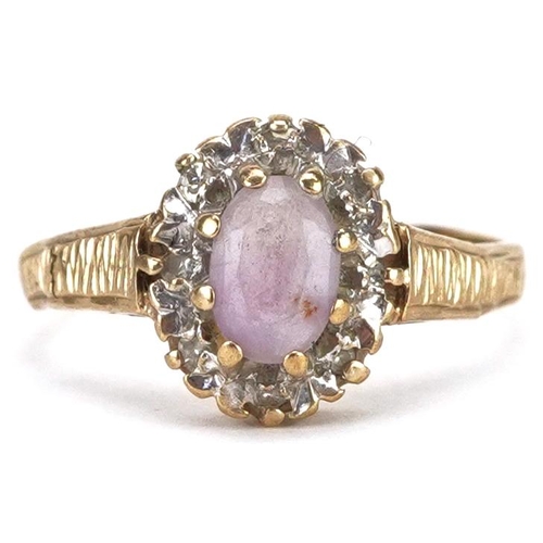 2157 - A 9ct gold amethyst and diamond cluster ring, size J, 1.8g.