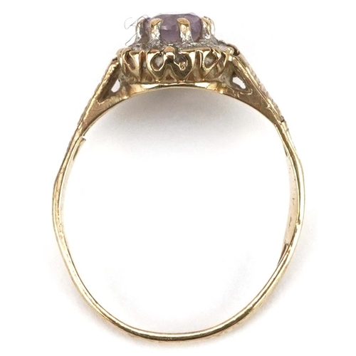 2157 - A 9ct gold amethyst and diamond cluster ring, size J, 1.8g.