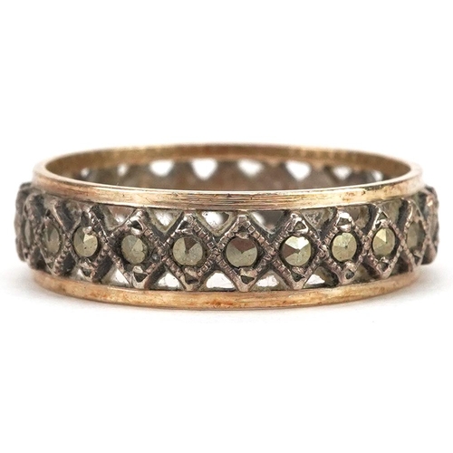 2059 - A 9ct gold and silver marcasite eternity ring, size O, 2.5g.