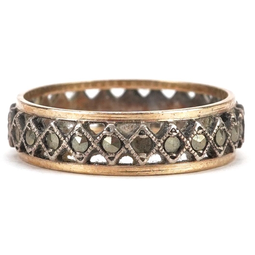 2059 - A 9ct gold and silver marcasite eternity ring, size O, 2.5g.