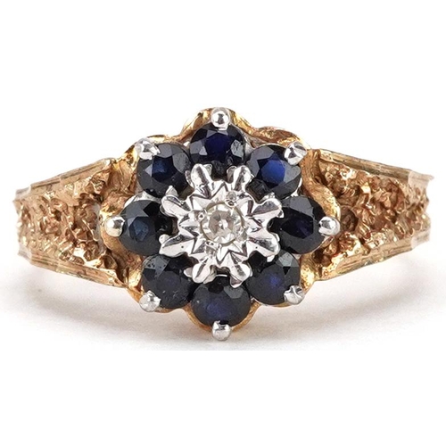 2061 - A 9ct gold diamond and blue spinel flower head ring with naturalistic setting, size N, 3.4g.