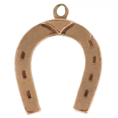 2154 - A 9ct gold lucky horseshoe pendant, 2.3cm high, 2.5g.