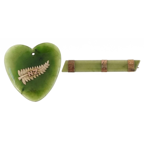 2511 - A green jade brooch with 9ct mounts and a New Zealand jade love heart pendant with yellow metal moun... 