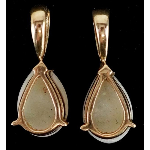 2531 - A pair of unmarked gold opal teardrop pendants, 1.6cm high, total 1.6g.