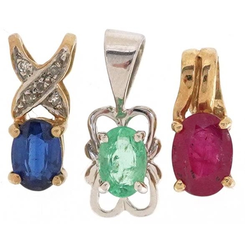 2520 - Three unmarked gold semi precious stone solitaire pendants set with ruby, emerald, blue spinel and d... 