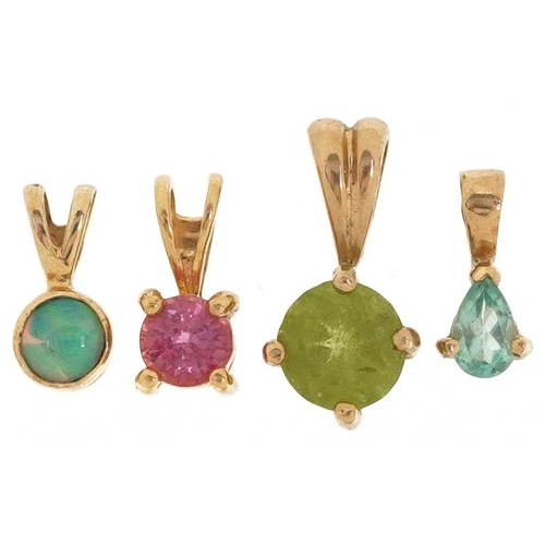 2527 - Three gold semi precious stone pendants including opal and blue topaz, the largest 1.5cm high, total... 